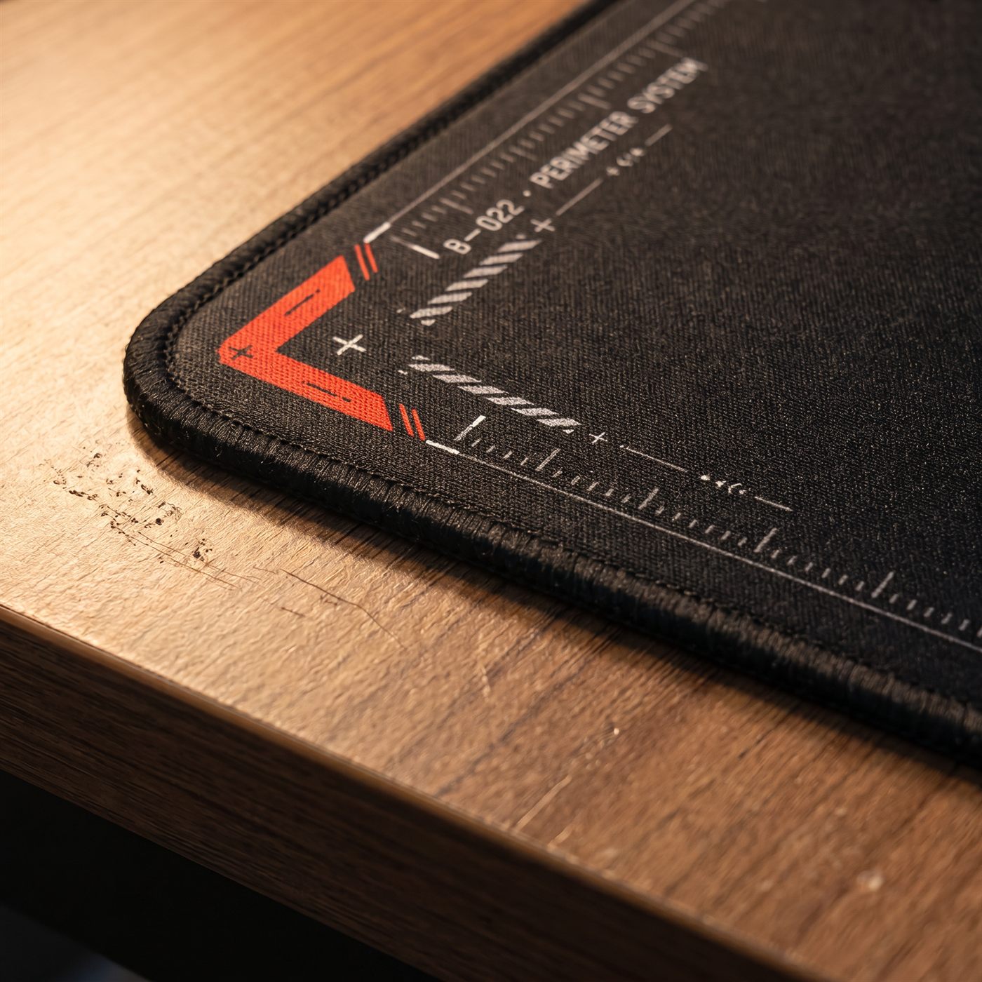Close-up of a premium BACKSTOCK desk mat surface