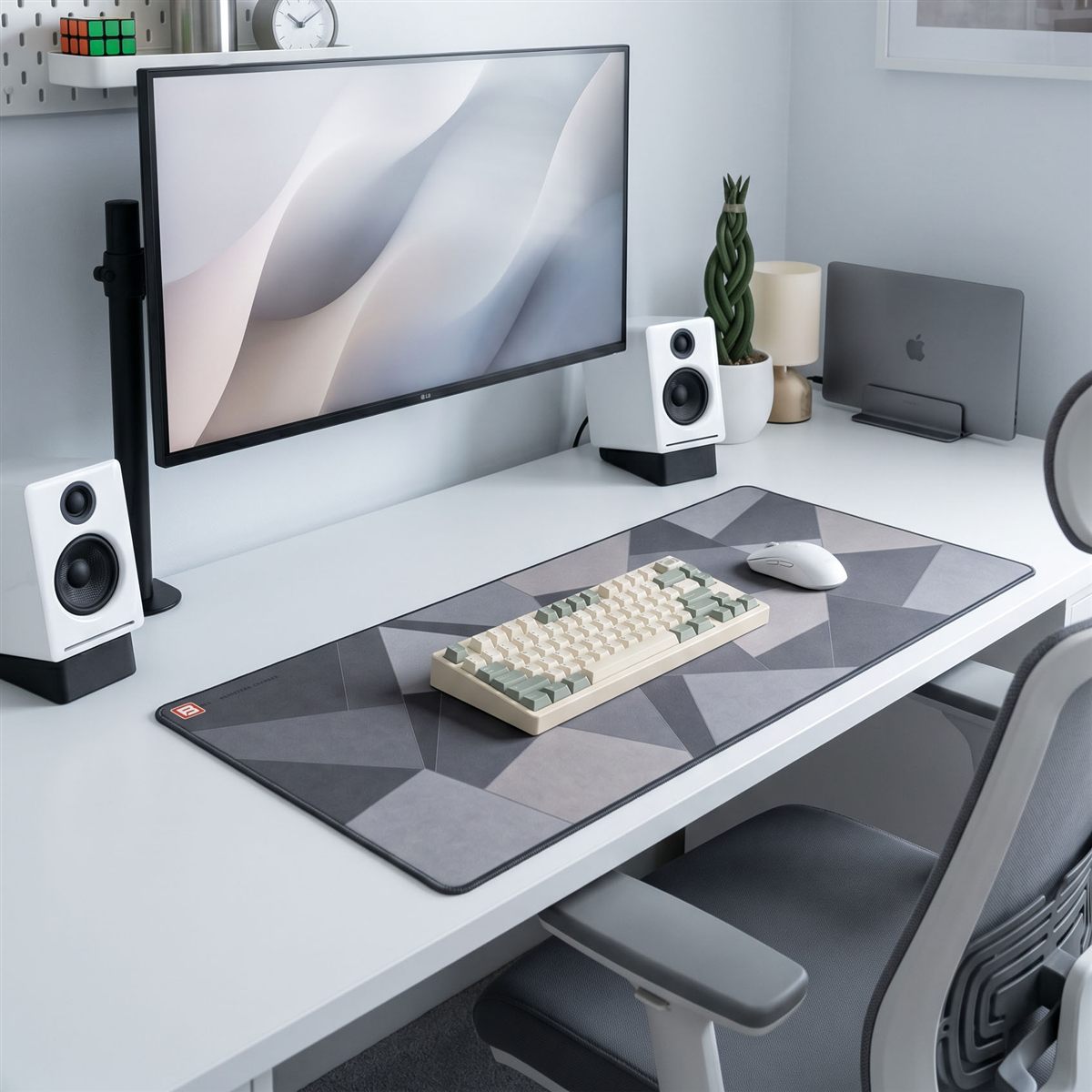 A fully designed desk setup built around a BACKSTOCK desk mat as the foundation