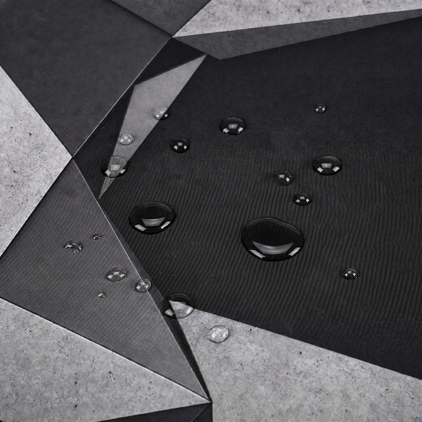 Water beading on the water-resistant surface of a BACKSTOCK desk mat